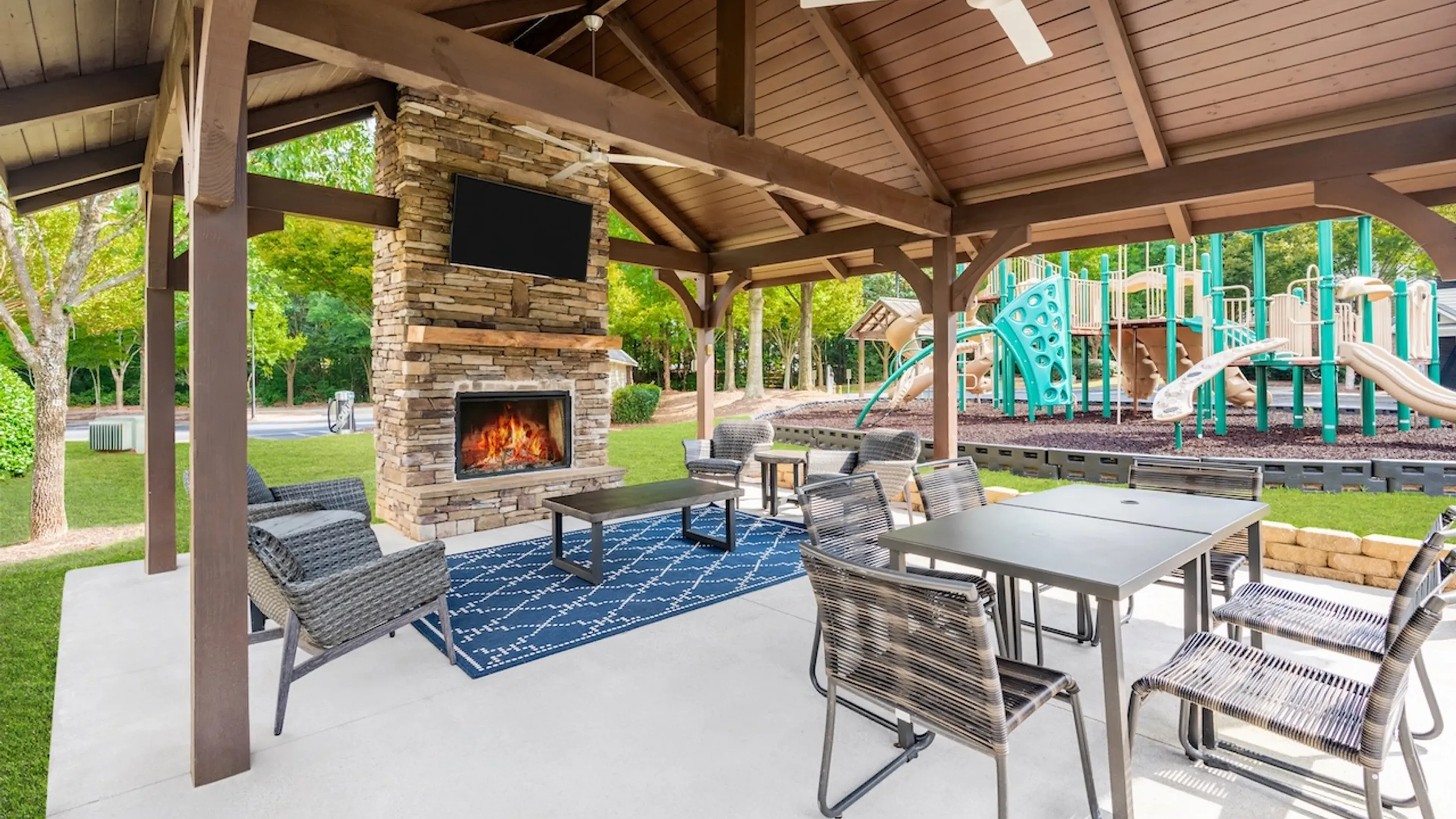 Hawthorne at Kennesaw outdoor lawn with pavilion, lounge seating, and fireplace