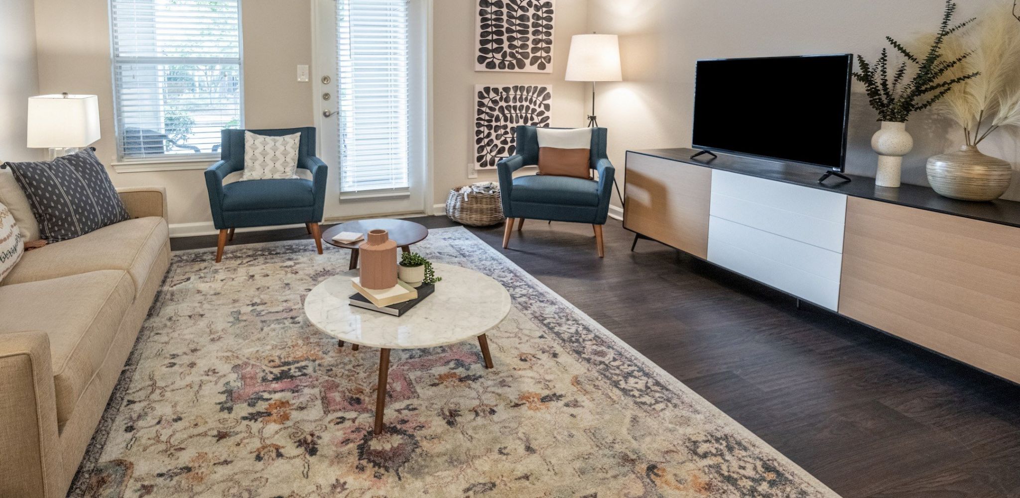 Hawthorne at Kennesaw apartment living room with large patio door, furnished with a couch, coffee table, and chair